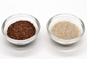 Obraz na płótnie Canvas Psyllium and linseed in transparent bowls, detailed view in a photo box