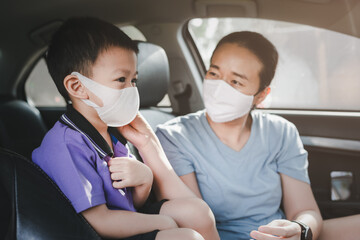 Fototapeta na wymiar Little asian boy with mother wearing mask for protect from coronavirus for Living outside.Back to school.New normal post covid-19. Education back to School kid. Air pollution concept.
