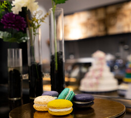 Macarons with cream inside on a golden plate