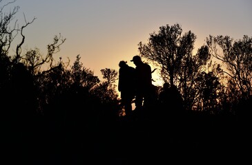 Unrecognizable people  at sunset on the Valley of Desolation near the Karoo town of Graaff-Reinet...