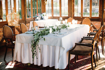 Festive table setting for birthday or wedding in style of rustic, boho. Decor in natural colors. Selective focus.