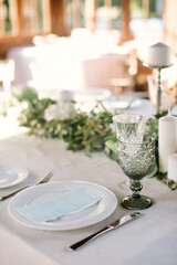 Festive table setting for birthday or wedding in style of rustic, boho. Decor in natural colors. Selective focus. 