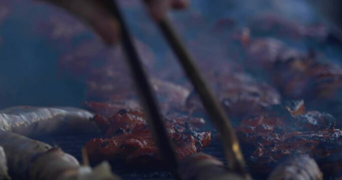 Close-up shot of meat and sausages on a grill at El Dorado County Fair.
