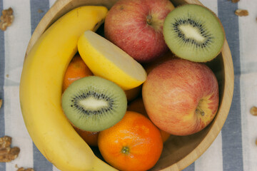 fruits on a plate with kiwi