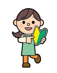初心者マークを持ったエプロン姿の女性