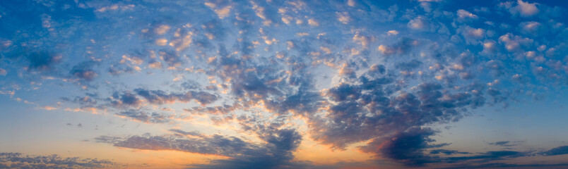 Panorama, cloudy sky at sunset. Pink clouds.