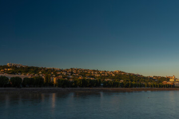 Fototapeta na wymiar Bratislava capital in summer evening with color sunset and river Donau