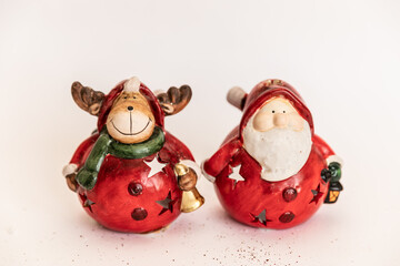 Christmas. New Year's jewelry. gold and red. Christmas deer and santa claus toys.