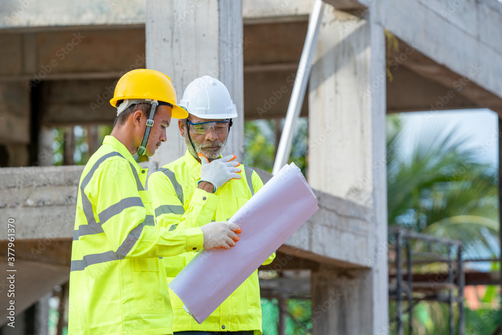 Leinwandbilder architects and engineers with blueprint discussing work at new construction sites,engineering tools 