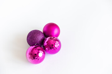 Christmas tree jewelry. purple balls on a blank background
