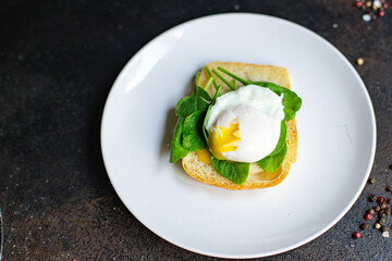 tasty poached egg sandwich
 spinach and other ingredients on the table serving portion size top view place copy space for text