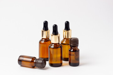 A set of amber bottles for essential oils and cosmetics. Glass bottle. Dropper, spray bottle