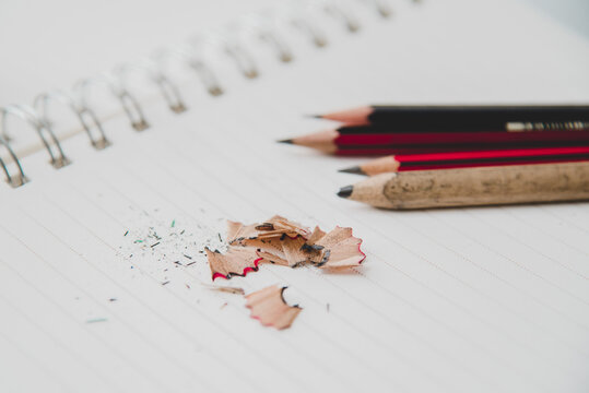 Notebook and pencil with pencil shavings