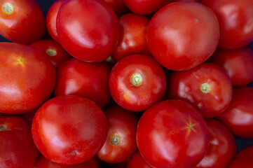 Big red and pink tomatoes close up background