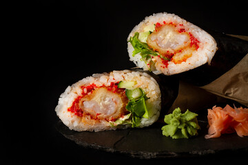  sushi burrito , sushiritto, with  shrimp rice, spice sauce, cucummber, lettuce, nori, on a black background