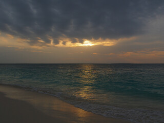Fototapeta premium Sunset view above the water of the ocean in Zanzibar island, Tanzania. Copy space for text.