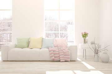 White living room with sofa and winter landscape in window. Scandinavian interior design. 3D illustration