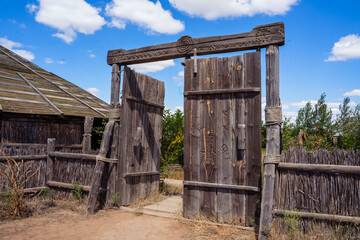 structures made of branches with a dome and a wicker fence