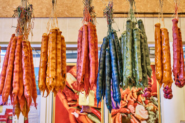 local sweetness-churchkhela from juice and nuts at the authentic bazaar of a resort town on the...