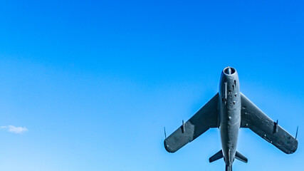 Old military plane, flying fighter on sky background