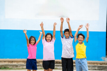 Obraz premium Happy elementary children playing together,Back to school education concept.