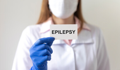 Doctor with word Epilepsy on paper. Medical concept