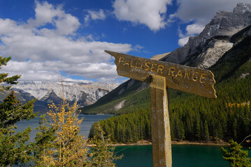 Sign with graffiti pointing to Palliser Range mountains at Lake Minnewanka