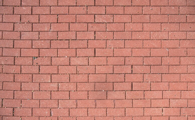 Background of orange paving stones, paving slabs and small stones on it