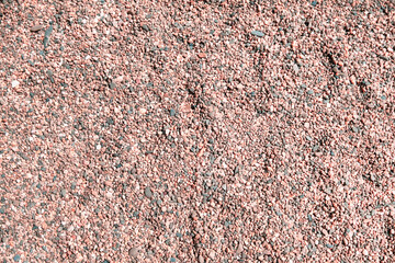 Background of small pink and grey (gray) stones, pebbles on the beach