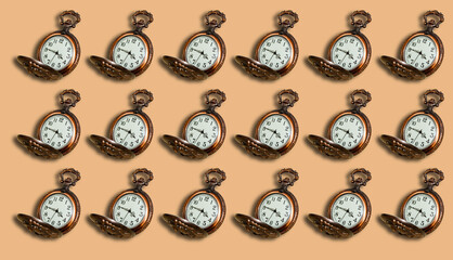 Pattern from an Old pocket watch on a beige background.