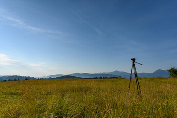  camera with tripod take photo on mountain beautiful view