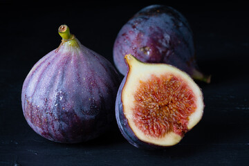 Purple fig on black background
