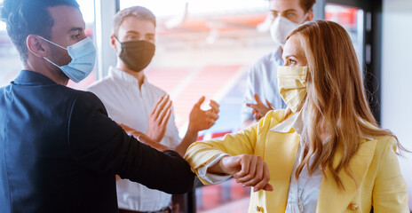 Business team closing deal by using the corona bump instead of handshake