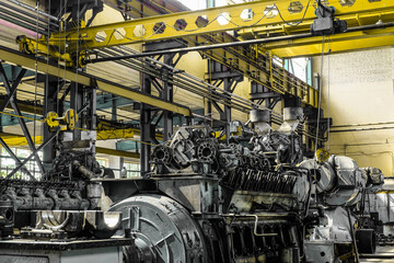Diesel locomotive engine in a repair workshop with overhead crane