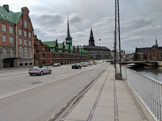 Fototapeta premium street with cars next to the former stock exchange building in Copenhagen, Denmark