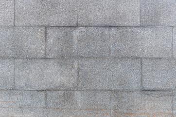 abstract background of a lined with granite tiles pavement