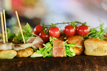 Delicious snacks on the banquet table. Dishes for catering, canapes.