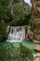 Fototapeta na wymiar Vero river waterfall in Alquezar, Spain