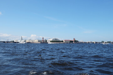 Obraz premium View from a boat to the coast in the city of St. Petersburg in Russia, you can see beautiful buildings on the embankment
