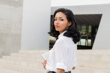 Beautiful exotic woman bare back and shoulder with face turned