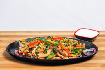 Chicken mushroom and capsicum stir fry recipe served on a sizzling plate. Chicken Fajita Recipe, Asian recipes.