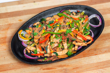 Chicken mushroom and capsicum stir fry recipe served on a sizzling plate. Chicken Fajita Recipe, Asian recipes.