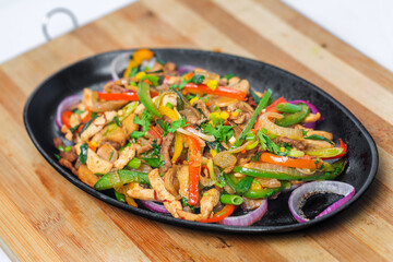 Chicken mushroom and capsicum stir fry recipe served on a sizzling plate. Chicken Fajita Recipe, Asian recipes.