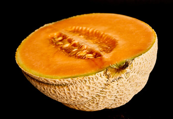 yellow melon on black background