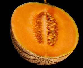 yellow melon on black background