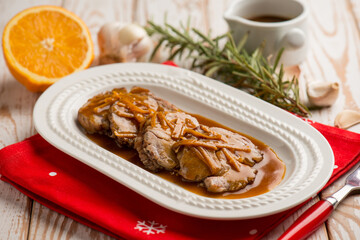 sliced roasted meat witn orange sauce