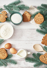 Merry Christmas background tasty homemade ginger cookies. Ingredients for cooking baking, kitchen utensils, gingerbread. Happy new year greeting card. Xmas table. Fir tree, pine. Winter holidays