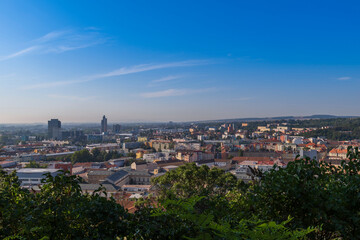 A view of the city of Brno in the Czech Republic in Europe. In the background is a blue sky with clouds.