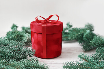 Merry Christmas gift box greeting card. Gifts, fir tree branches on white background Winter holidays. Red Luxury New Year present. Christmastime celebration. Xmas mock up.