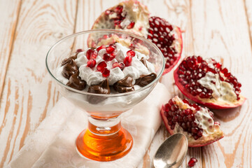 dessert cup with pomegranate chocolate and  chantilly cream